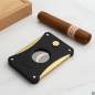 Vorschaubild: Caseti Paris Zigarrencutter schwarz gold auf einem Tisch