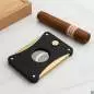 Vorschaubild: Caseti Paris Zigarrencutter schwarz gold auf einem Tisch