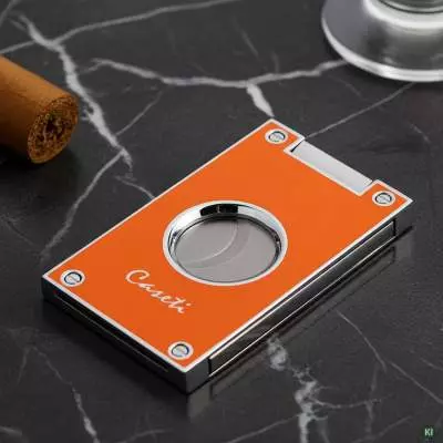 Produktbild: Caseti Paris Zigarrenschneider orange auf einem Tisch