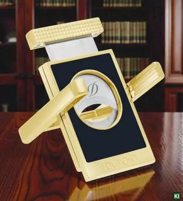 Produktbild: S.T. Dupont Zigarrencutter schwarz gold 003553 auf dem Tisch