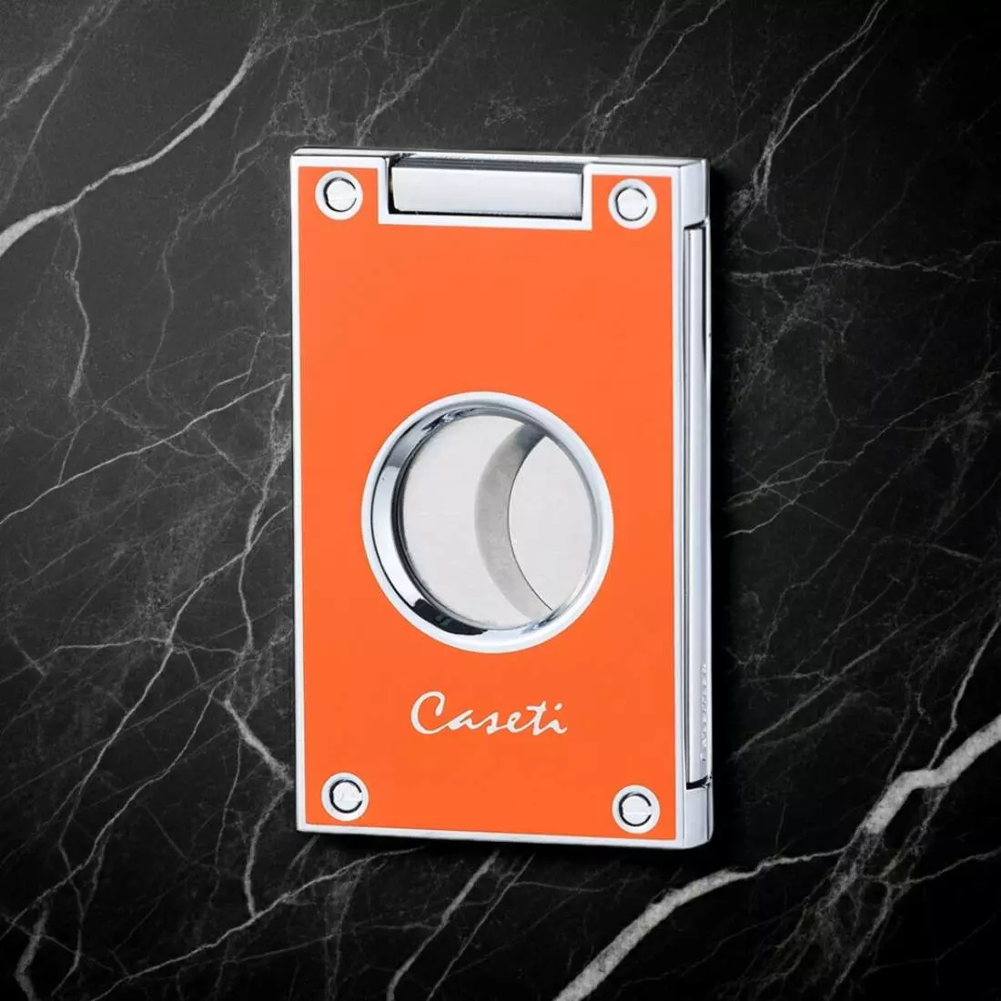 Produktbild: Caseti Paris Zigarrenschneider orange auf Marmor