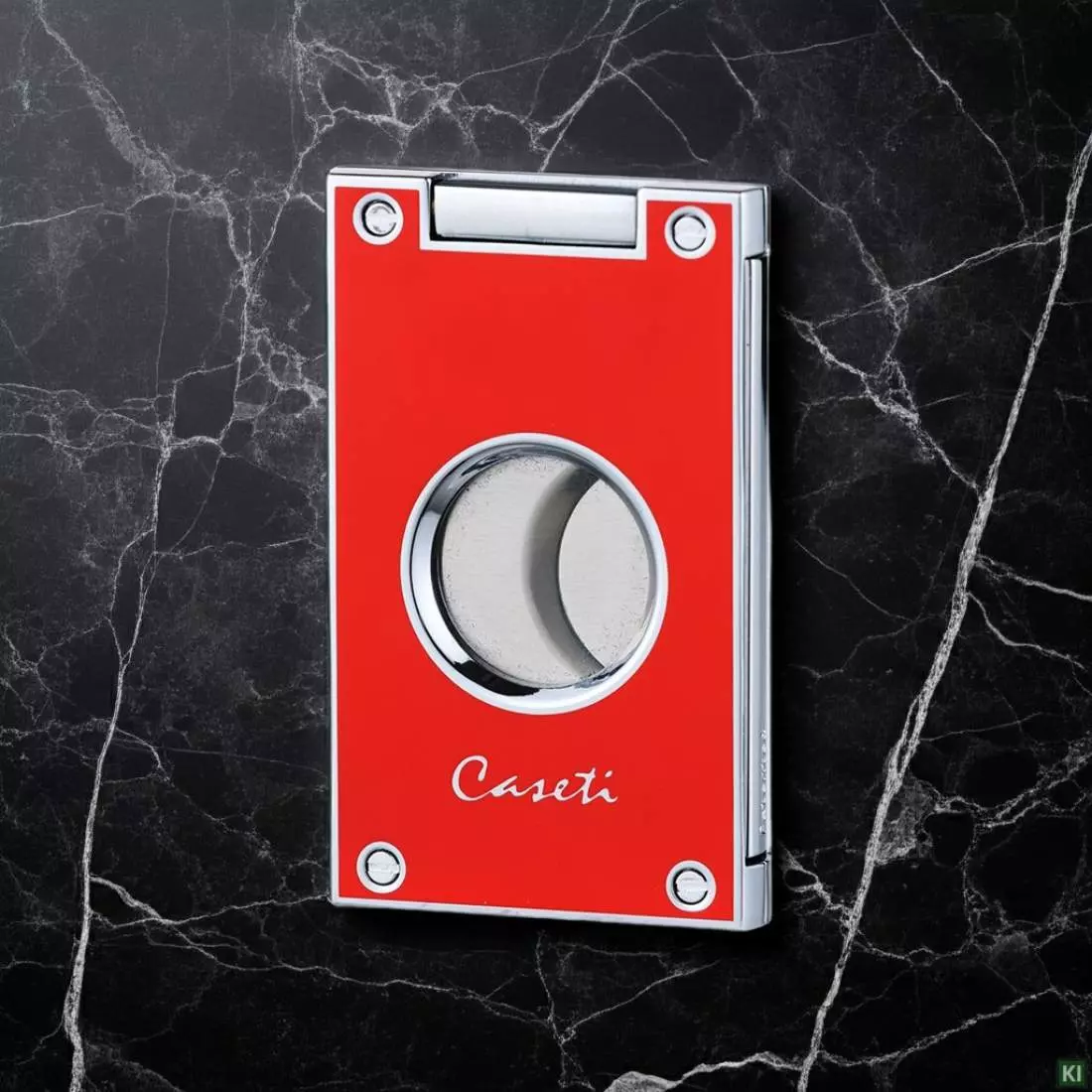 Produktbild: Caseti Paris Zigarrenschneider rot auf Marmor